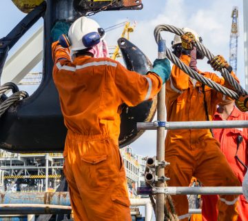 Offshore,Workers,Installing,Big,Sling,Onto,Crane,Block,In,Preparation